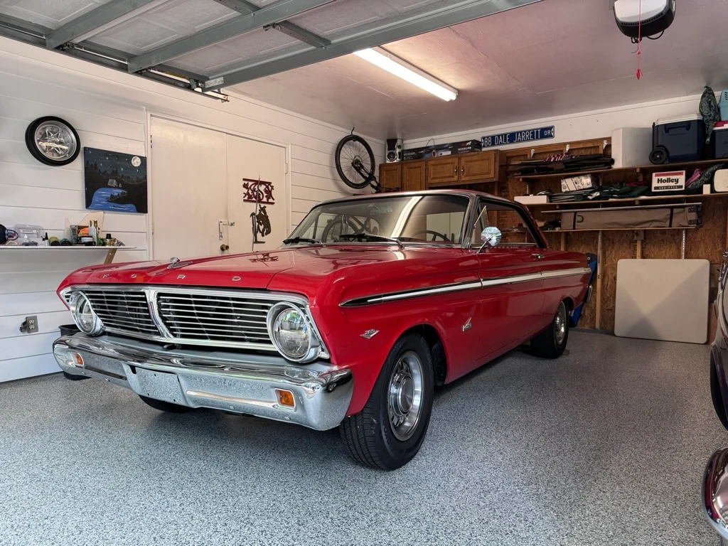 Classic red car in a finished garage