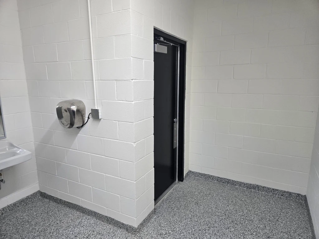Coordinated flake floor in a restroom vanity and doorway area