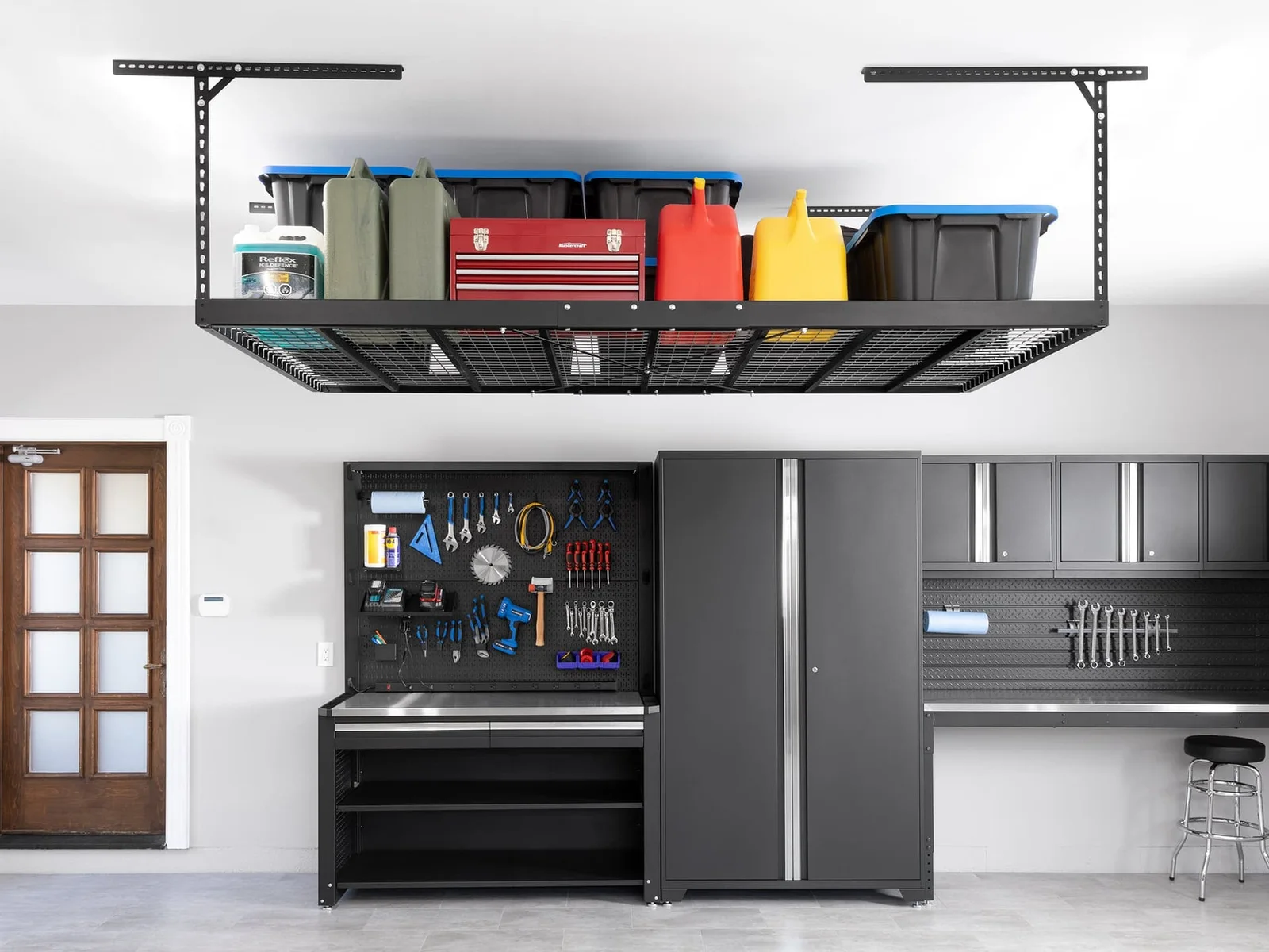 NewAge overhead storage, cabinets, and wall organization in a finished garage