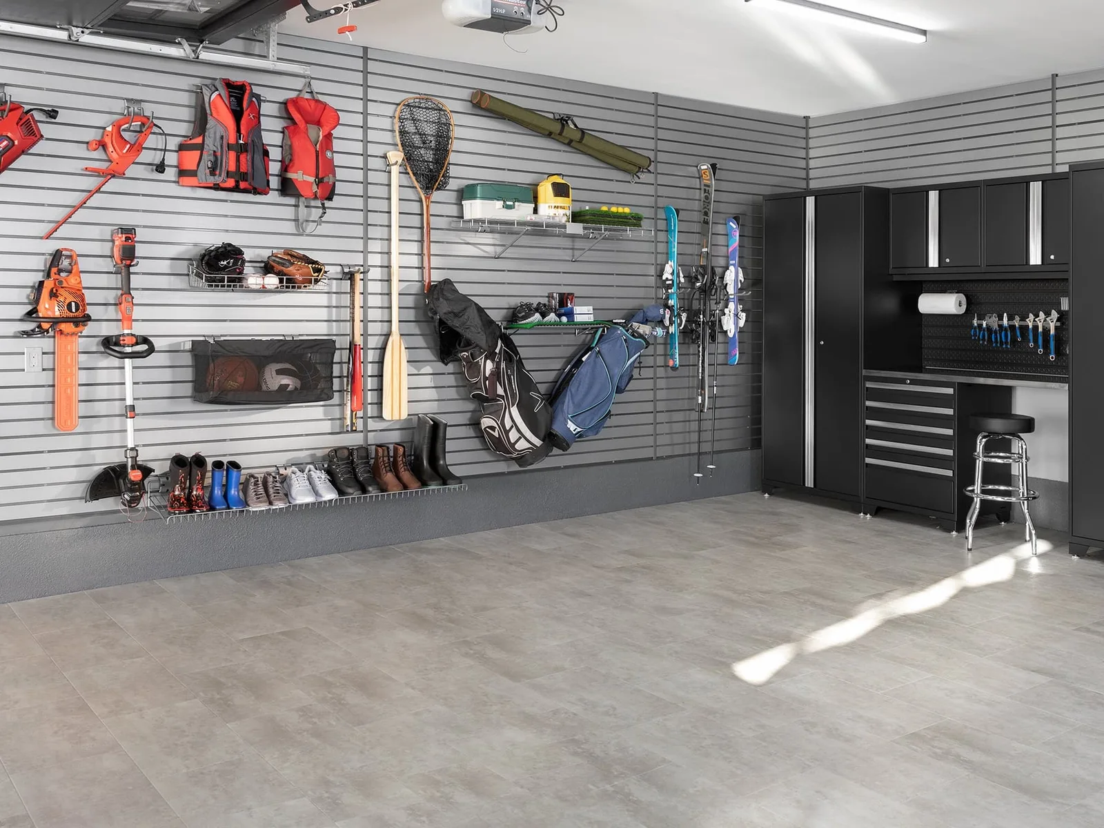 NewAge slatwall storage with adjustable hooks and accessories for garage organization