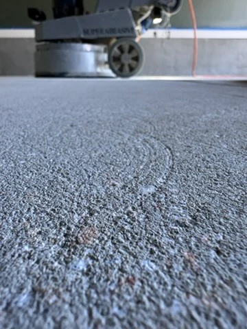 Close-up of the textured concrete surface after mechanical grinding